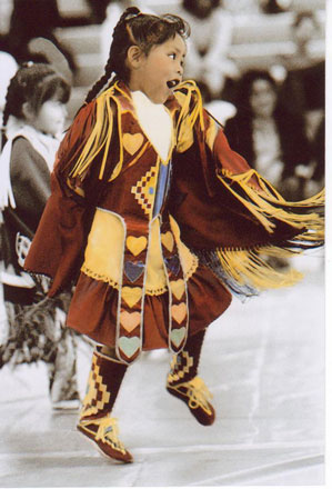 Photo of a Little Girl Dancing in Cultural Clothes 