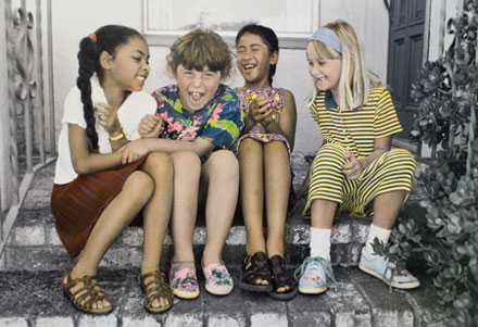 Photo of Four Girls Sitting on Steps 